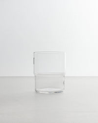 Clear glass tumbler on a white background