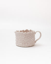 White textured mug on a white background