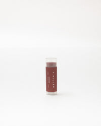 Lip balm stick with 'F. Miller' branding on a white background