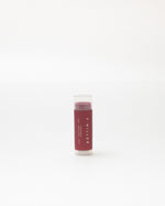 Lip balm stick with visible brand name on a white background