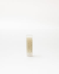 Small cylindrical container with a white background