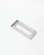 Rectangular metal object on a white background