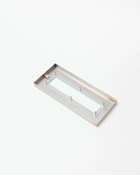 Rectangular metal object on a white background