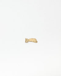 Gold charm on a white background