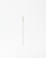 A delicate silver wheat stalk pin with a textured, bead-like head and a long, slender stem, shown on a plain white background.