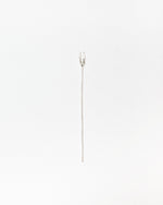 A single silver fork with a long straight post photographed against a plain white background.