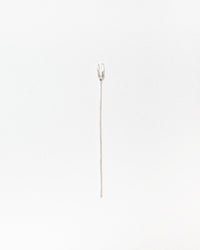 A single silver fork with a long straight post photographed against a plain white background.
