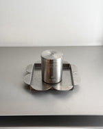 Mini candle placed on clover shaped tray