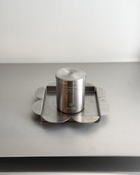 Mini candle placed on clover shaped tray
