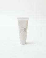 White tube of foam cleanser on a white background